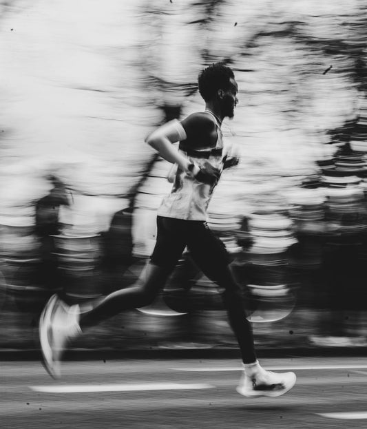 Marathon runner racing at pace, fuelling strategy for carbs per hour